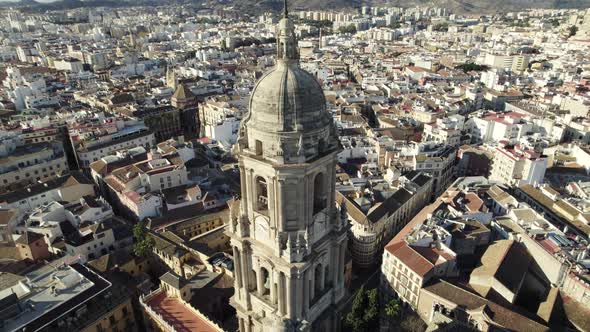 Aerial riser reveals iconic Malaga Cathedral tower, Renaissance style church