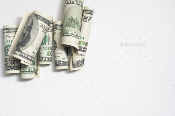 Belted roles of dollars closeup - Stock Photo - Images