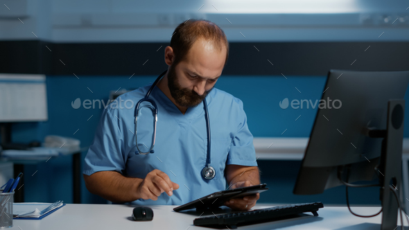 Physician man assistant holding tablet computer typing medical expertise