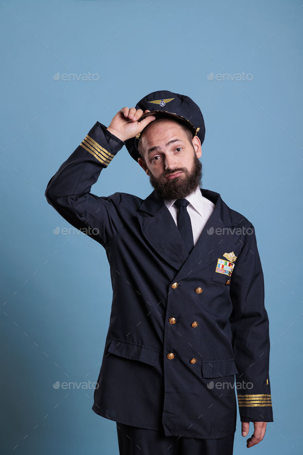 Airplane capitan taking hat off,