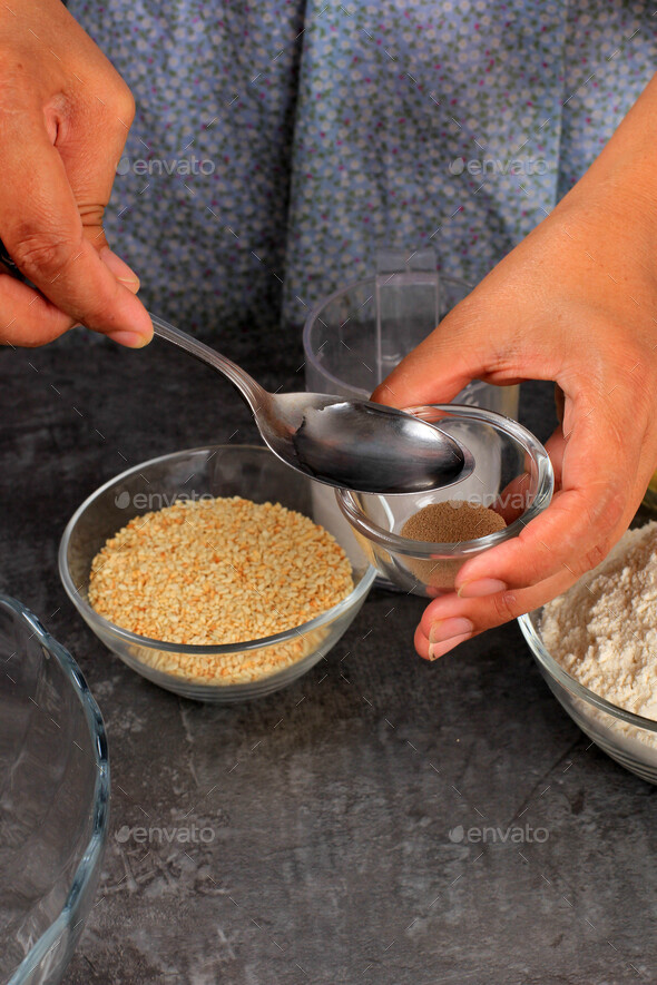 Female Hand Add Water to Instant Yeast, Baking Process Step by Step in the Kitchen