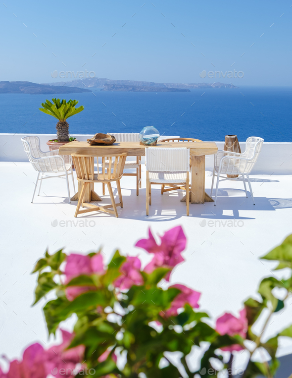 outside terrace of a restaurant by the ocean of Santorini Greece ...