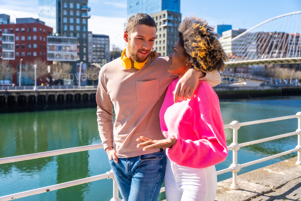 Multiracial friends on the streets of the city, lifestyle concept ...