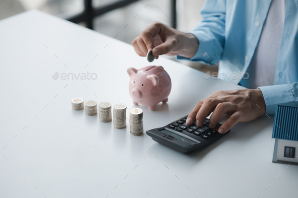 Person with stack of coins and piggy bank, saving money concept for future use and financial stabili