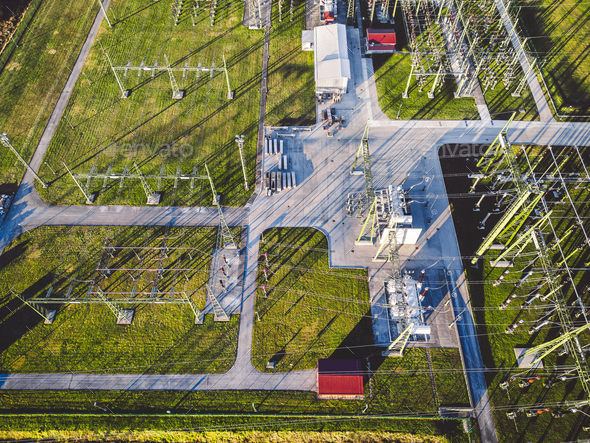 Top down aerial view, right above electrical power substation in the countryside