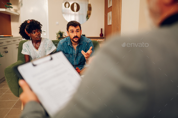 Diverse couple on a therapy session in a psychologist office