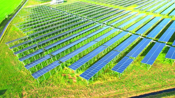 Aerial shot of Solar Power Station at morning. 4k drone footage. alt