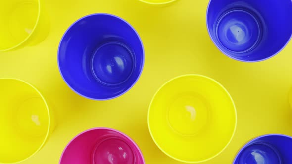 Download Top View Color Plastic Cup On Yellow Background By Puzurin Videohive PSD Mockup Templates