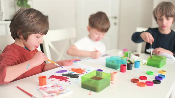 Kid Painting at Kindergarten alt