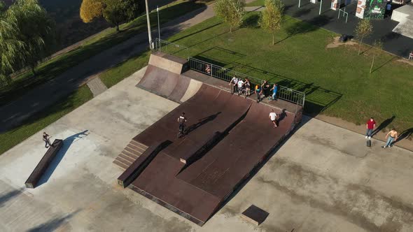 Children Ride on the Outdoor Skateboard Court