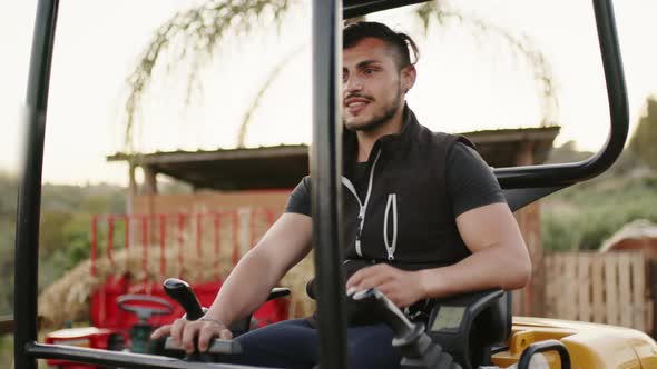 Worker is Operating an Excavator in the Countryside alt