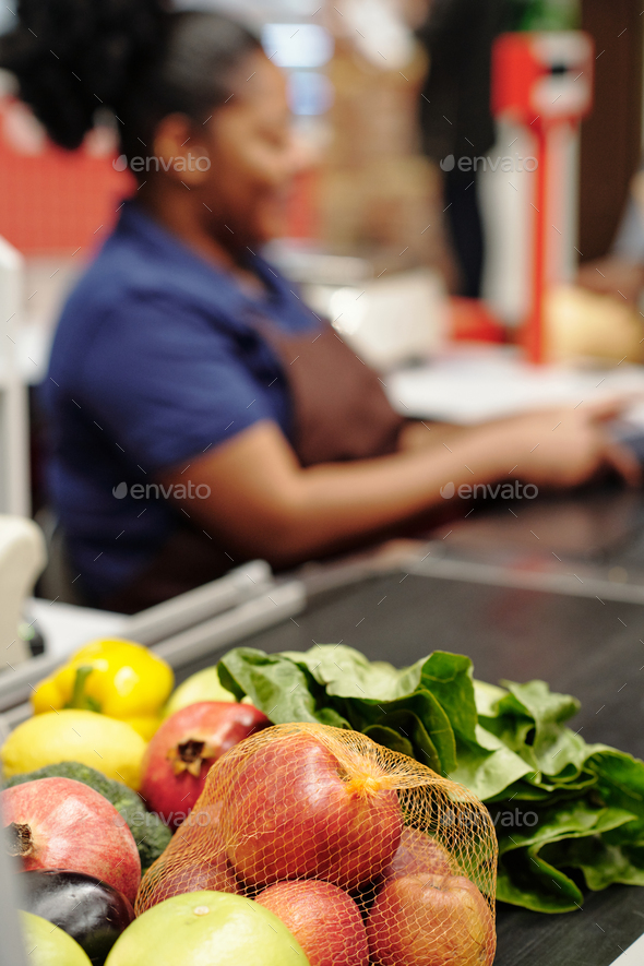 Focus on fresh fruits and vegetables on checkout line
