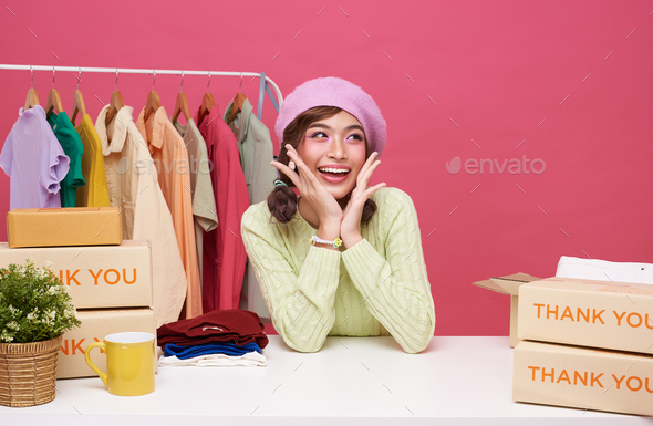 Young asian woman startup small business freelance with parcel box and sitting