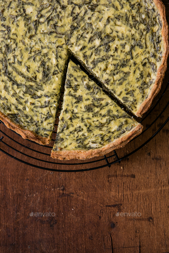 Quiche with spinach traditional dish of french cuisine. Spinach tart Stock Photo by sokorspace