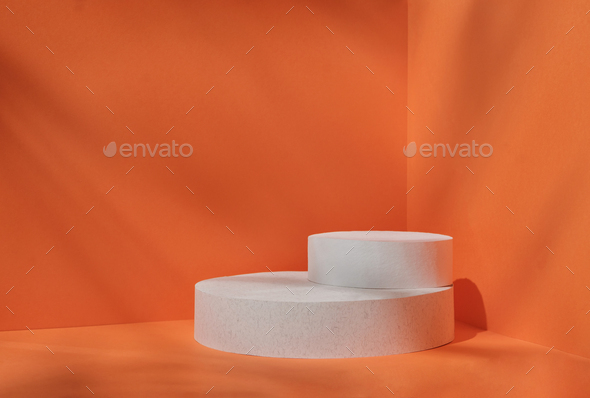 Minimal stage for a modern product display on a white podium cilindre on an orange background. - Stock Photo - Images