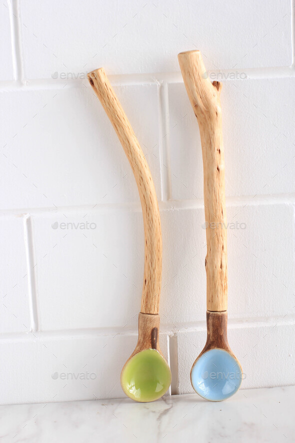Empty Ceramic Spoons. Indonesia Handrafted Spoons with Natural Rustic Wooden Handle Stock Photo