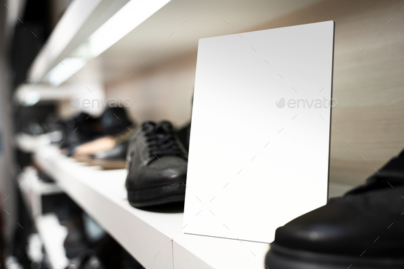 point of sale empty shelf sign poster holder mockup in shoe store - Stock Photo - Images