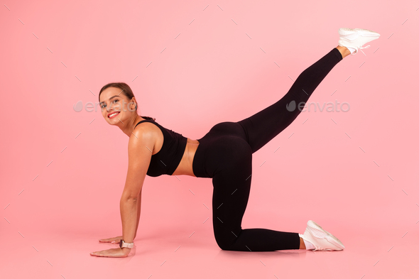 Body Shaping Concept. Smiling Sporty Woman Doing Leg Raise Exercise Stock  Photo by Prostock-studio