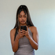 Portrait of young woman seen using her cellphone - PhotoDune Item for Sale