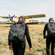 Two parachutists are going to the airplane. - PhotoDune Item for Sale