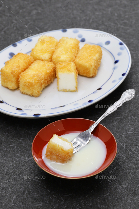 crispy fried milk with condensed milk, Chinese dessert Stock Photo by