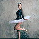Graceful young ballerina in pointe shoes standing on tiptoes - PhotoDune Item for Sale