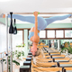 Female doing upside down split on pilates cadillac - PhotoDune Item for Sale