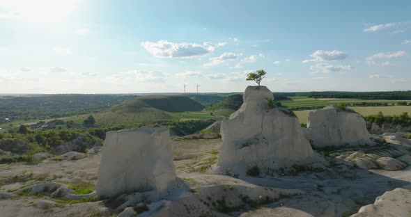 flying by a tree on peak of the fetesti quarry in moldova