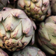 Close-up of bunch of fresh artichokes in the market top view, vegetable background. - PhotoDune Item for Sale