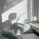 Shadow of a woman on the bed in the rays of the sun in the bedroom, waking in the morning. - PhotoDune Item for Sale