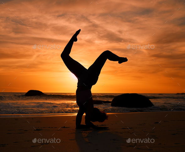 Silhouette of a women in meditation pose on sea beach during surreal sunset  on sea background and dramatic sky 4525427 Stock Photo at Vecteezy