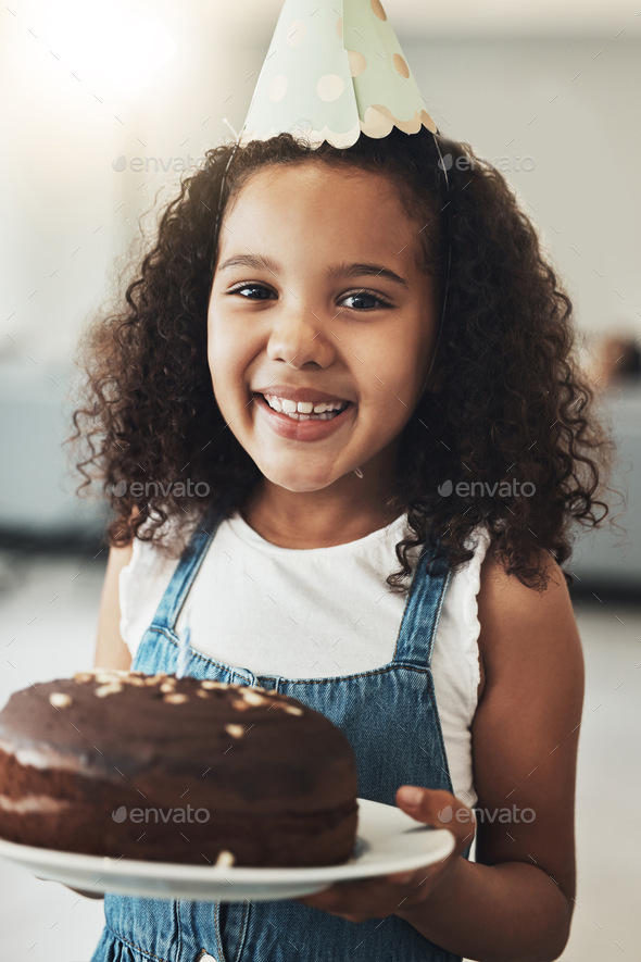 Portrait of happy girl with birthday cake, child in home and surprise ...