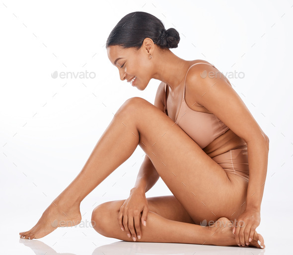 Back of female legs on white background Stock Photo