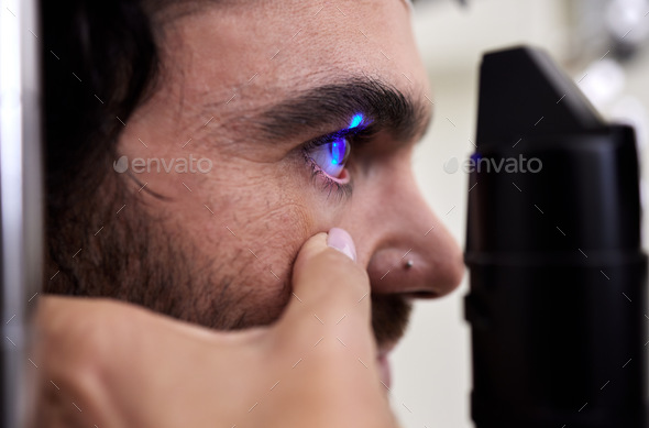 Eye exam, vision or laser test for patient with machine at optometry consultation for retina proble - Stock Photo - Images