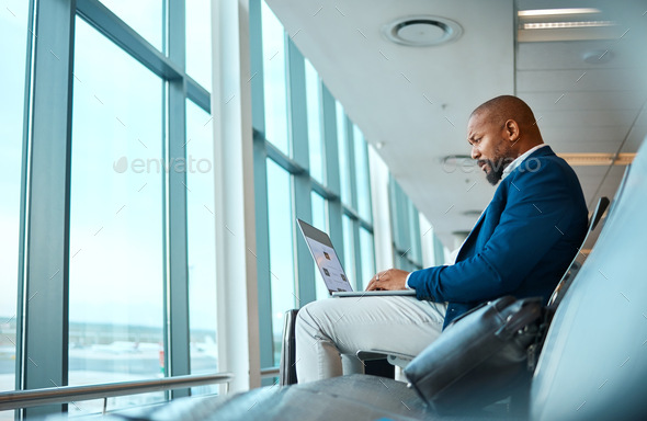 Travel, laptop and website with black man in airport for online booking, vip lounge and communicati