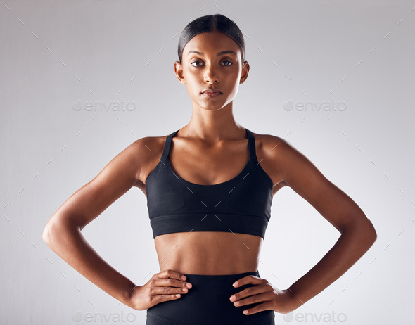 Fitness, motivation and health with portrait of indian woman for training,  workout and wellness goals. Exercise, diet and mindset with girl athlete  for mission, cardio and sports in studio background Photos