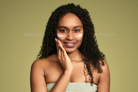 Smiling ethnic woman with eye patches - Stock Photo - Images
