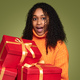 Amazed black woman with gift boxes - PhotoDune Item for Sale