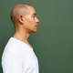Profile view portrait of handsome bald man wearing t-shirt - PhotoDune Item for Sale