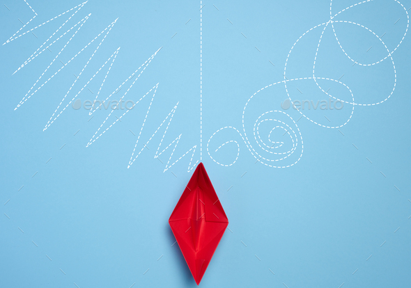 A red paper boat stands in front of different paths, the concept of finding the optimal route