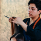 Young male hairdresser cutting client hair - PhotoDune Item for Sale