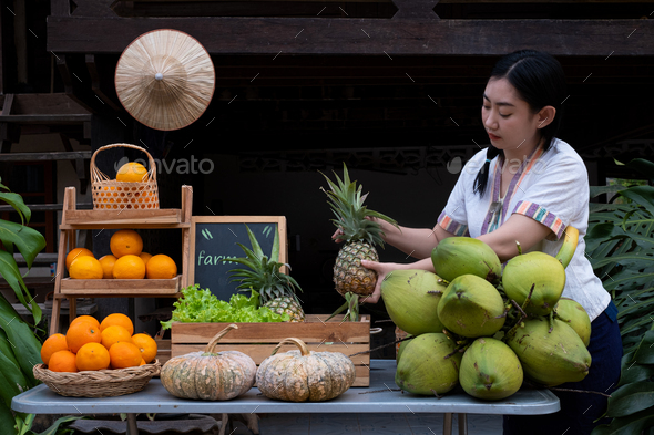 Asia woman selling fruits at the farm stay, Homestay
