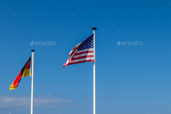 American flag and a German flag waving together in the air Stock Photo ...
