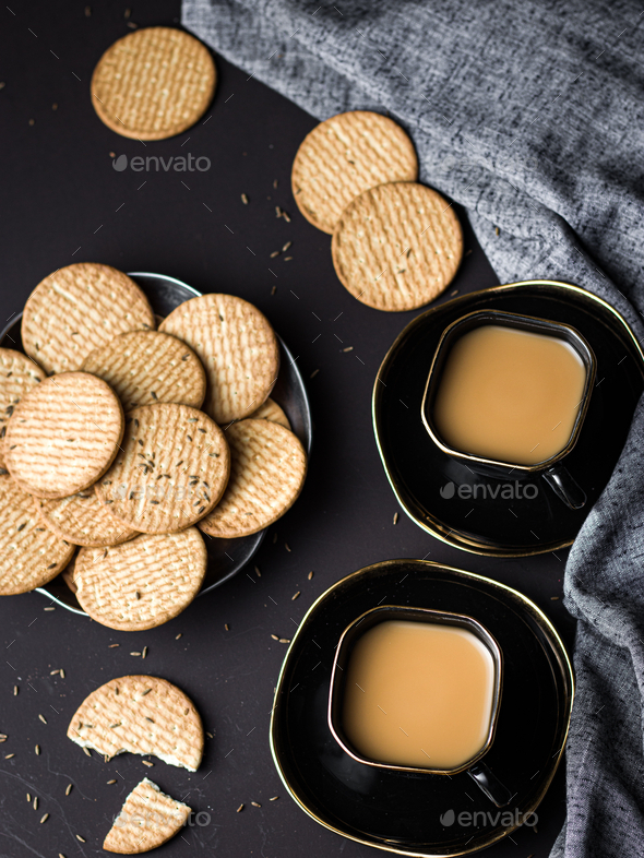 Indian chai in glass cups with metal kettle and other masalas to make the  tea. Stock Photo