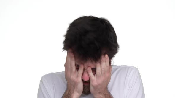 Caucasian Male Hysterically Touching Face on White Background alt