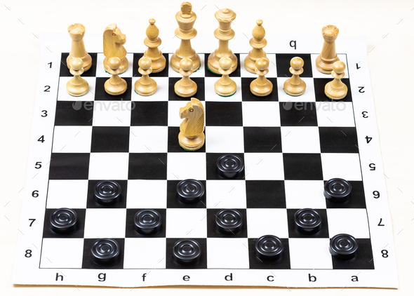 above view of non-standard knight move on board - Stock Photo - Images