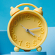 The dawn of a new season: Vintage alarm clock signals the start of spring with a reminder to spring  - PhotoDune Item for Sale