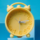 A time for renewal: Vintage alarm clock welcomes the start of spring with a cheerful message to spri - PhotoDune Item for Sale