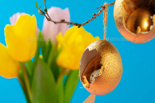 Easter decor, eggshells painted golden with quail egg inside