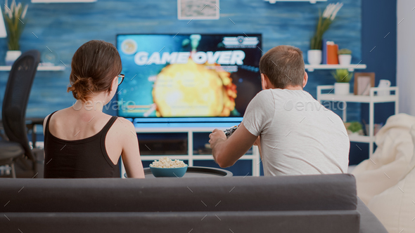 Premium Photo  Boyfriend and girlfriend feeling angry about lost  videogames, playing online on cyberspace. frustrated couple losing gameplay  on television console, gaming in play competition.